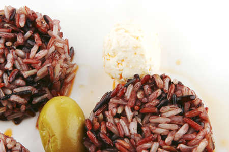 mozarella cheese and dark rice served on plateの写真素材