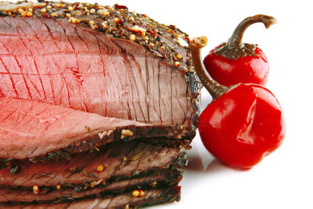 meat slice and red hot pepper on whiteの写真素材