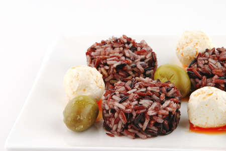 mozarella cheese and dark rice served on plateの写真素材