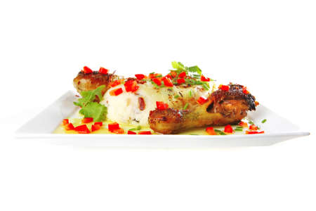 roast legs with mashed potatoes on whiteの写真素材