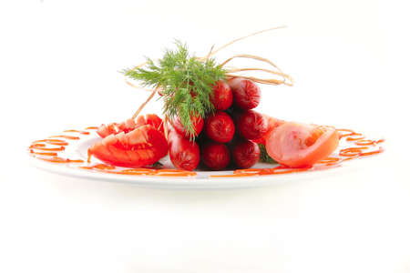 smoked sausages on a white plate over whiteの写真素材