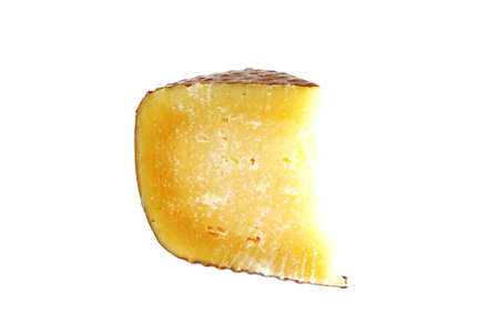 piece of cheddar cheese over white backgroundの写真素材