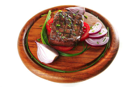 served roasted beef fillet with tomato on wooden dishの写真素材
