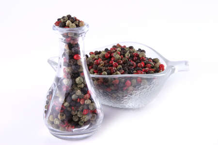 dry pepper inside glass over white backgroundの写真素材