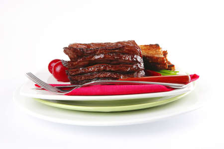 roast beef meat with dishware over whiteの写真素材