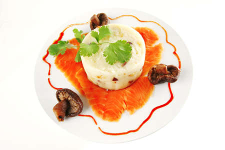 red smoked salmon with mash served on white plateの写真素材