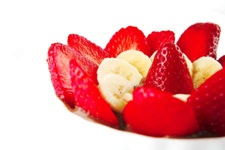 strawberry fruit salad isolated on white plateの写真素材