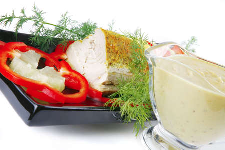 tuna fillet on black ceramic plate with cream sauceの写真素材