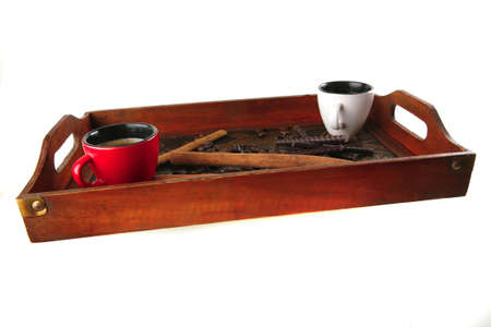 coffee with chocolate and cinnamon served on wooden trayの写真素材