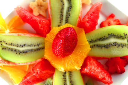 served fresh raw tropical fruits on plateの写真素材