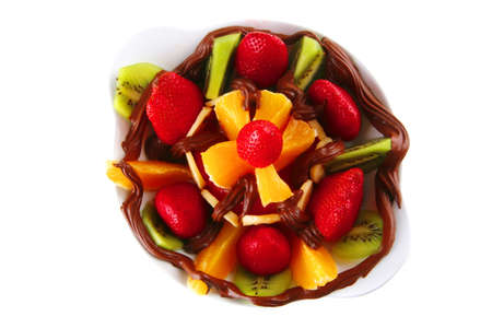 fresh raw fruits in chocolate cream on white
