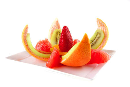 fresh raw tropical fruits served on whiteの写真素材
