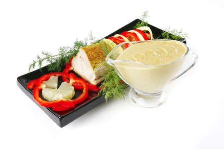 tuna fillet on black ceramic plate with cream sauceの写真素材