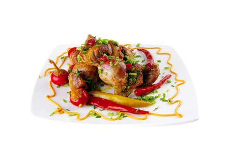 meat and hot peppers on white plateの写真素材