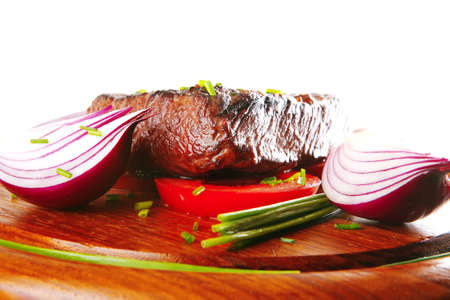 roasted beef fillet served with wooden on plateの写真素材