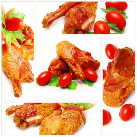 chicken wings served with tomatoe over white backgroundの写真素材