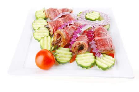 fresh served roasted meat rolls on white platterの写真素材