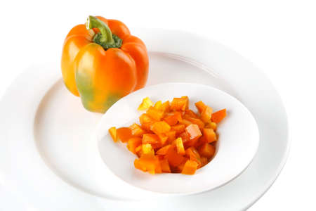 raw fresh orange bell pepper isolated over white