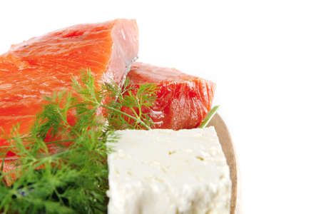 sinlge pink salmon bit on a big wooden dish with white cheeseの写真素材