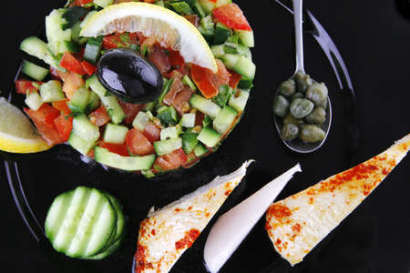 grille chicken meat chunks served black over whiteの写真素材