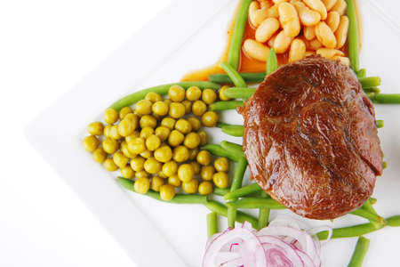 meat medalion on green beans with vegetablesの写真素材