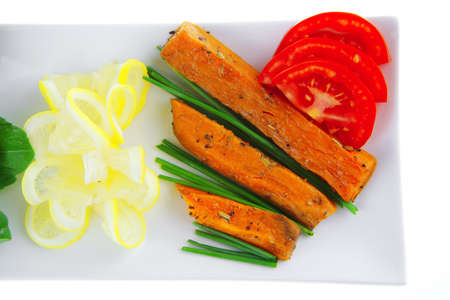 meatballs with tomatoes and lemon on basil leafの写真素材