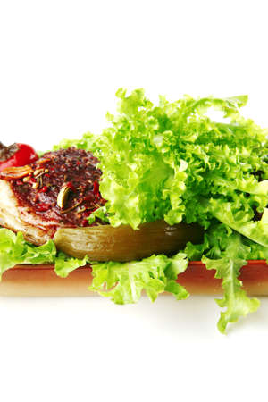 roast beef meat on green salad over whiteの写真素材