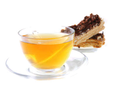 black tea and lemon cake on white backgroundの写真素材