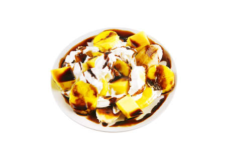 served mango and banana salad over whiteの写真素材