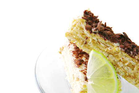 cake with chocolate served with lemon on saucerの写真素材