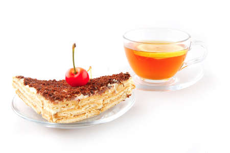 cherry cake and golden tea on whiteの写真素材