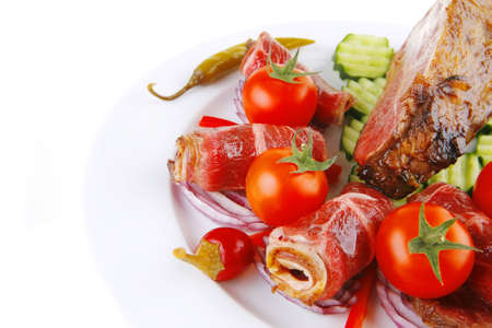 fresh roasted meat rolls and chunk on white platterの写真素材