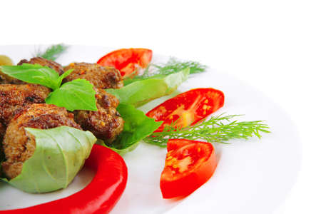 beef meatballs on basil with tomatoes and hot pepperの写真素材