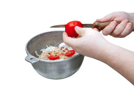 spicing meat in metal bowl over whiteの写真素材