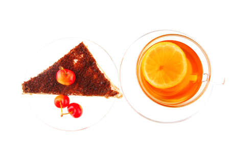 tea and chocolate cherry cake over whiteの写真素材