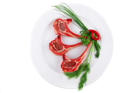 fresh raw lamb ribs served on plateの写真素材