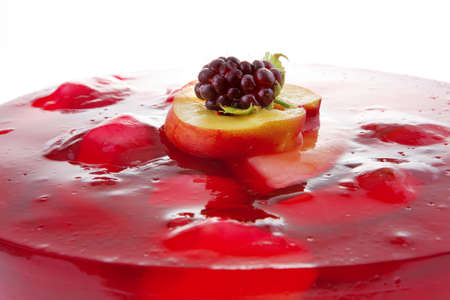 cold red jelly cake with fruits inside and blackberryの写真素材