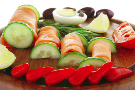 image of smoked salmon slices on dark woodの写真素材