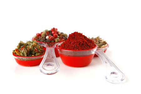 pepper in spoon isolated on white backgroundの写真素材