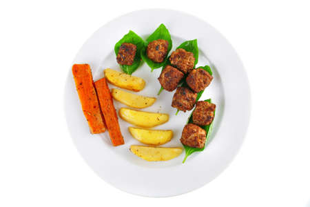 fried french cutlets with potatoes and basilの写真素材