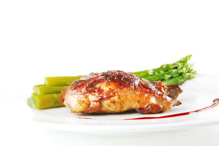 roast beef meat served with asparagus on whiteの写真素材