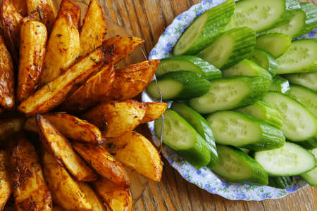 fresh vegetable salad served on wooden tableの写真素材