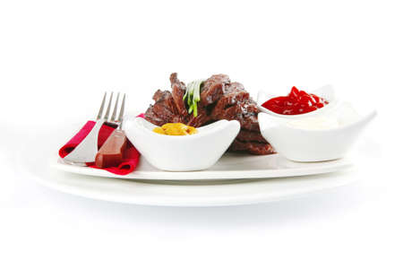 served sectioned beef meat on white dishの写真素材