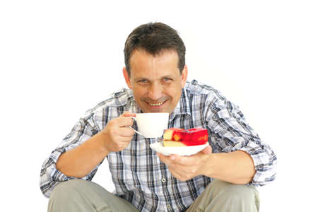 happy adult man with cake over whiteの写真素材