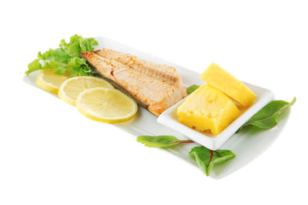 salmon steak on white plate with butterの写真素材