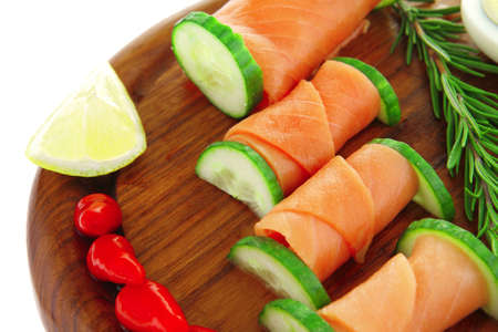 red smoked salmon slices with vegetables and lemonの写真素材