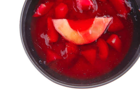 sweet cold red jelly cake with fruitsの写真素材