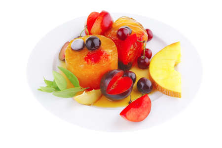 fruit ice cream with raw fruits on plateの写真素材