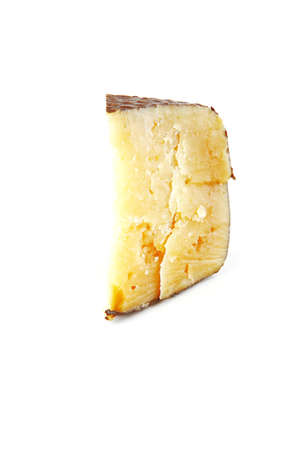 piece of solid cheese over white backgroundの写真素材