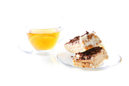 black tea and lemon cake on white backgroundの写真素材